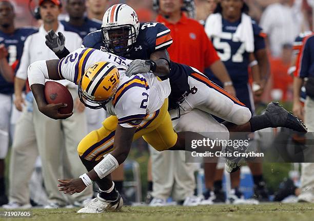 Quarterback JaMarcus Russell of the Louisiana State University Tigers is tackled by Karibi Dede of the Auburn University Tigers September 16, 2006 at...