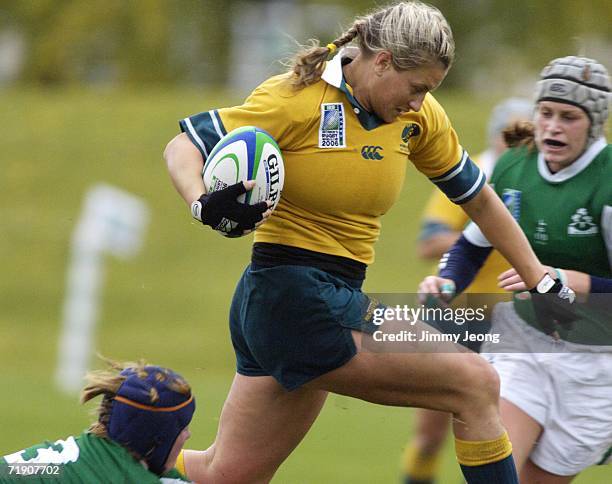 Ruan Sims of Australia runs with the ball against Ireland during day five of the Women's Rugby World Cup 2006 at Ellerslie Rugby Football Club on...