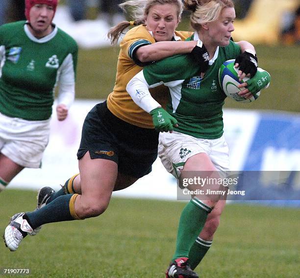 Ruan Sims of Australia tries to tackle Ireland's Lynne Cantwell during day five of the Women's Rugby World Cup 2006 at Ellerslie Rugby Football Club...