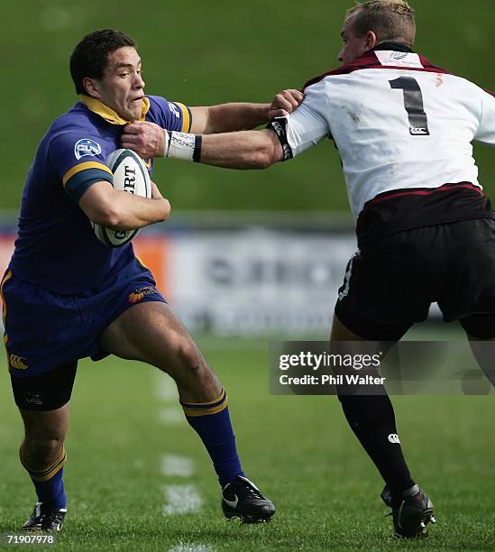 Glen Horton of Otago is tackled by Adrian Donald of North Harbour during the Air New Zealand Cup match between North Harbour and Otago at North...