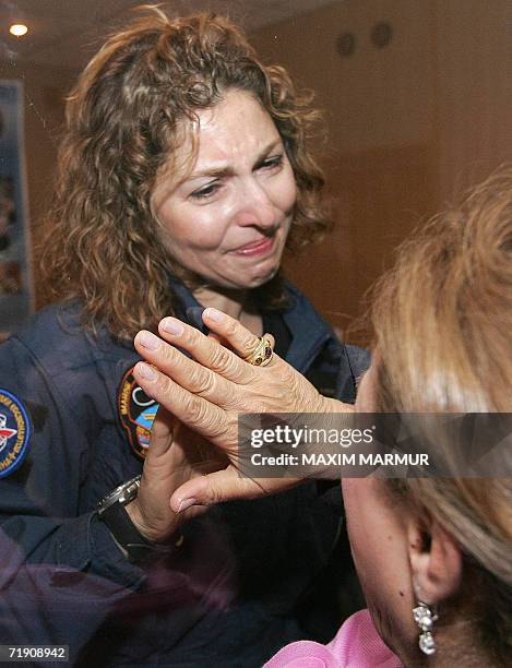 The world's first female space tourist Anoushen Ansari cries while meeting with her mother at Baikonur cosmodrome, 17 September 2006. The flight of...