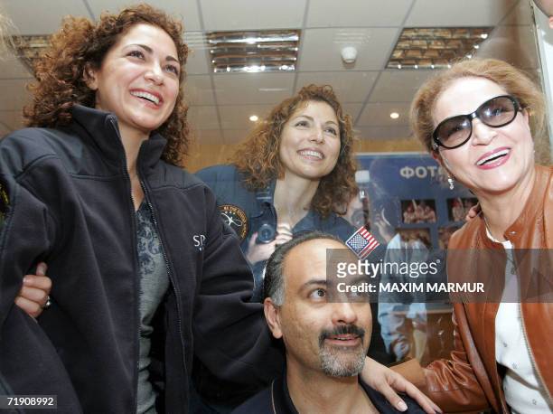 The world's first female space tourist Anoushen Ansari smile as she poses for a picture with her husband Hamid , her sister and her mother during a...