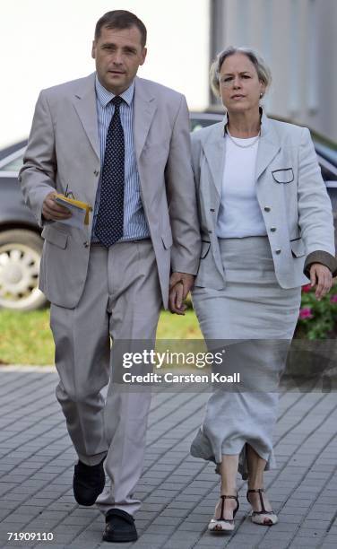 Udo Pastoers, top candidate of the far-right NPD political party, and his wife Marianne, arrive to cast the vote on September 17, 2006 in the small...