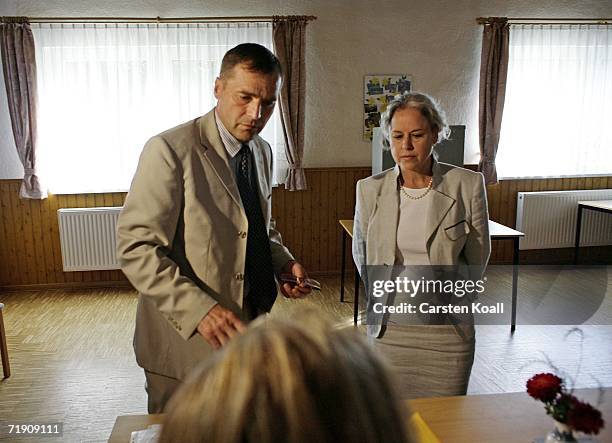 Udo Pastoers, top candidate of the far-right NPD political party,and his wife Marianne, cast their votes on September 17, 2006 in the small village...