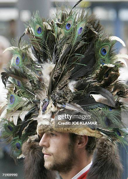 Parade participant wears a hat made out of peacock's feathers during the Sunday's costumes and riflemen's parade at the Oktoberfest beer festival on...