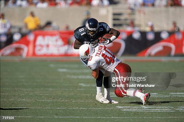 Charles Johnson of the Philadelphia Eagles gets tackled by Pat Tillman of the Arizona Cadinals during the game at the Sun Devil Stadium in Tempe,...