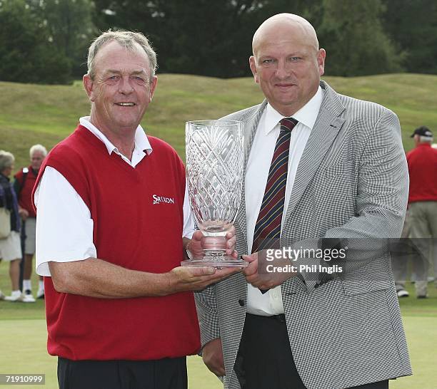 Carl Mason of England and Murdo Mace, Managing Director of Midas Construction representing the Midas Group pose with the trophy after the final round...