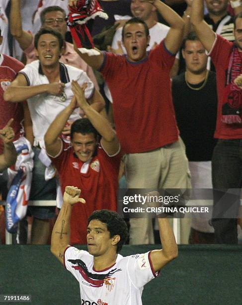 Sevilla's Brazilian Renato Dirnei celebrates a goal against Betis during a derby football match at the Sanchez Pizjuan stadium in Sevilla, 17...