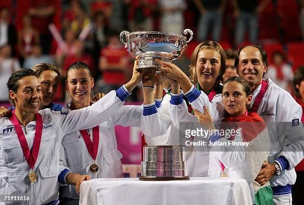 Francesca Schiavone, Flavia Pennetta, Mara Santangelo, Roberta Vinci and Coach Corrado Barazzutti of Italy celebrate defeating Belgium after the Fed...