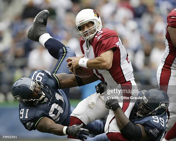 Quarterback Kurt Warner of the Arizona Cardinals is pressured by defensive tackle Rocky Bernard of the Seattle Seahawks in the second half of the...