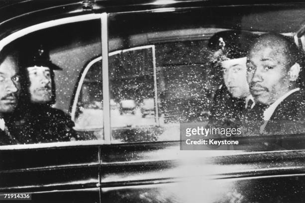 Aloysius 'Lucky' Gordon and Johnny Edgecombe, witnesses in the Profumo Affair, leave the Treasury by car with a police escort, 10th July 1963. Both...