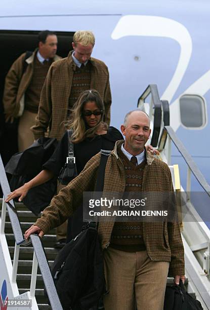 The United States Ryder Cup golf team captain Tom Lehman followed by his wife Melissa arrive at Dublin airport in Ireland, 18 September 2006. The...