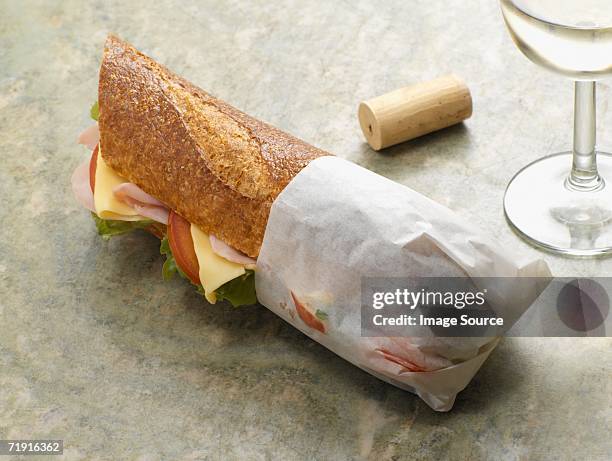 baguette and wine - wrap sandwich stock-fotos und bilder