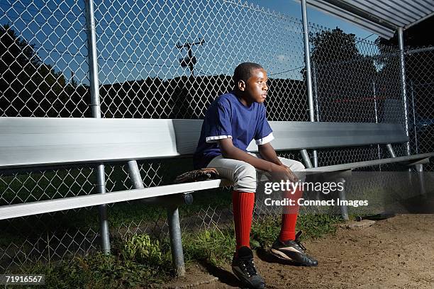 teenage boy watching from the sidelines - sideline baseball stock pictures, royalty-free photos & images