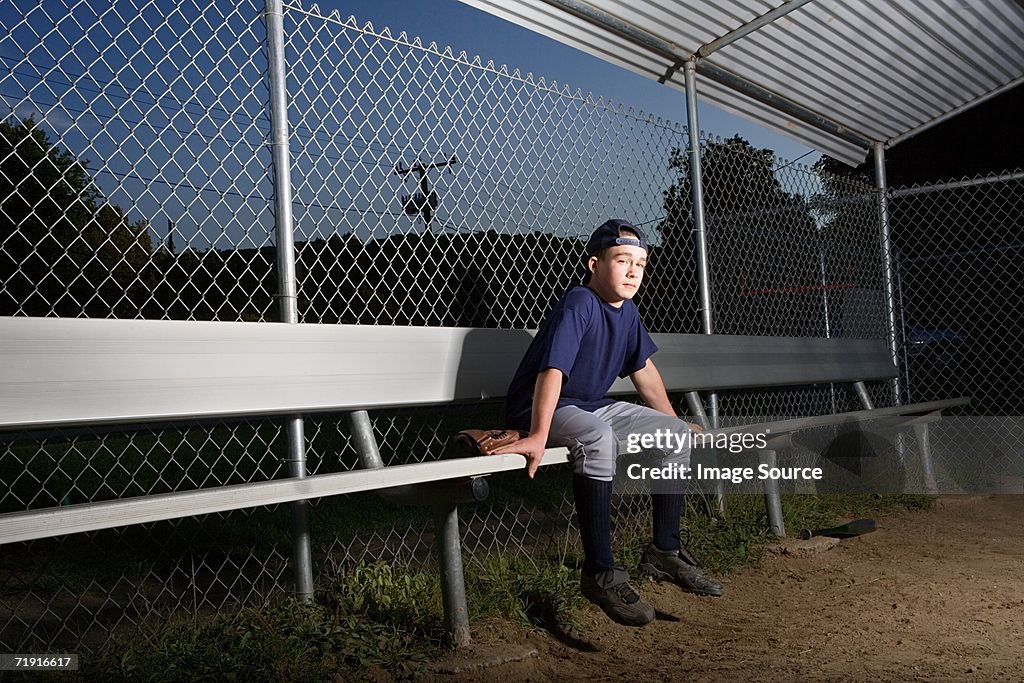 Teenage boy watching from the sidelines