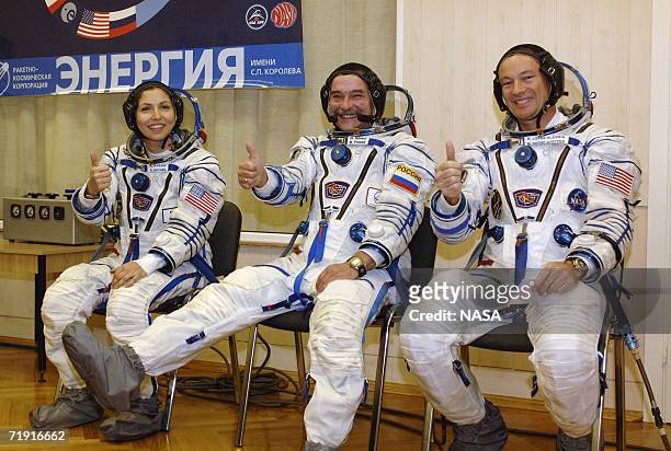 In this handout photo provided by NASA, American businesswoman Anousheh Ansari, Soyuz Commander and Expedition Flight Engineer Mikhail Tyurin and...