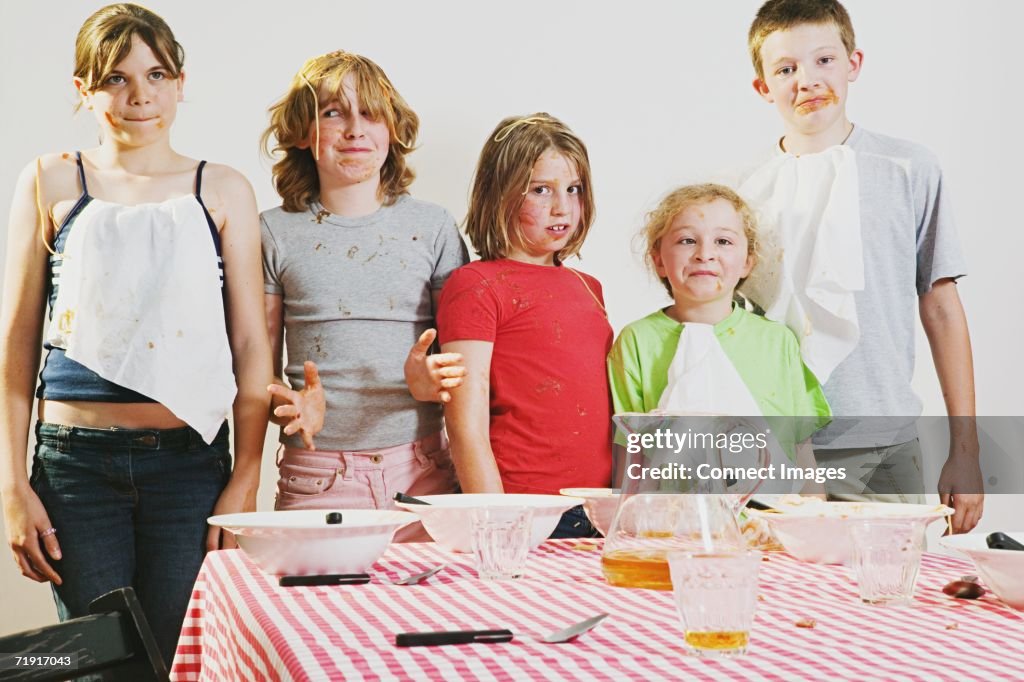 Messy children looking guilty