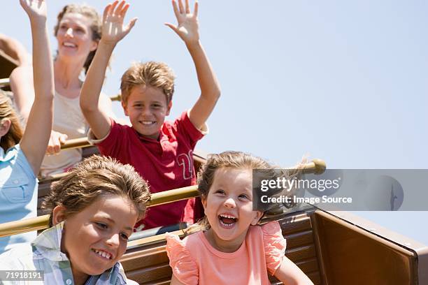 kids on a roller coaster - roller coaster people stock pictures, royalty-free photos & images