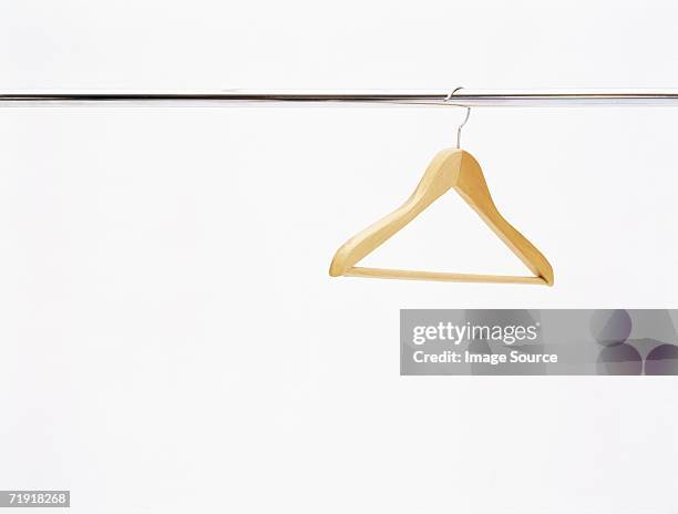 coat hanger on a rail - gancho imagens e fotografias de stock