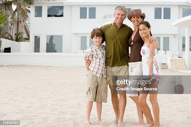 family at beach house - wealthy family stock pictures, royalty-free photos & images