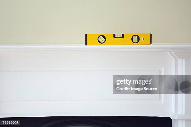 spirit level on a mantelpiece - mantelpiece stock pictures, royalty-free photos & images