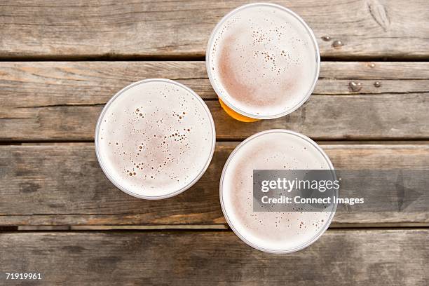 three pints of lager - empty beer glass stock pictures, royalty-free photos & images