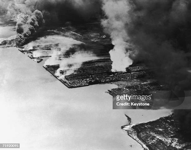 Burning warehouses on the coast during the Texas City Disaster, in which nearly 600 people were killed by an explosion of ammonium nitrate fertilizer...