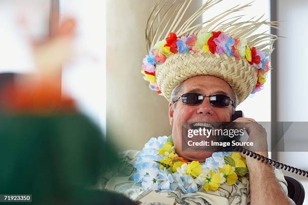 man on telephone wearing holiday clothes - bizarre office stock pictures, royalty-free photos & images