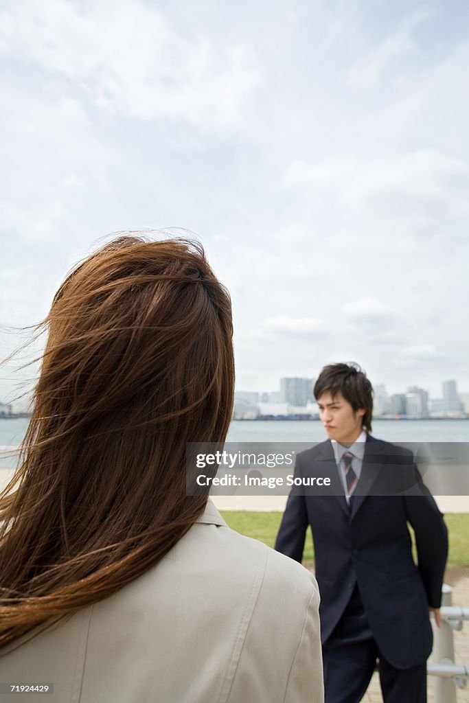 Businessman and woman outdoors