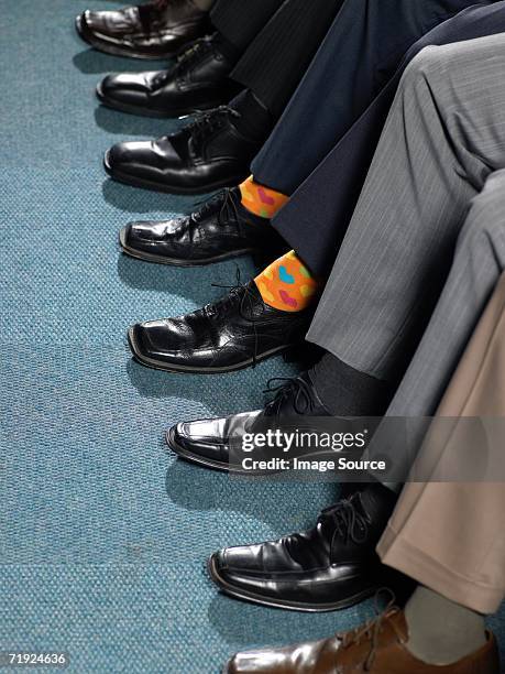 businessman sitting in a row - socks ストックフォトと画像