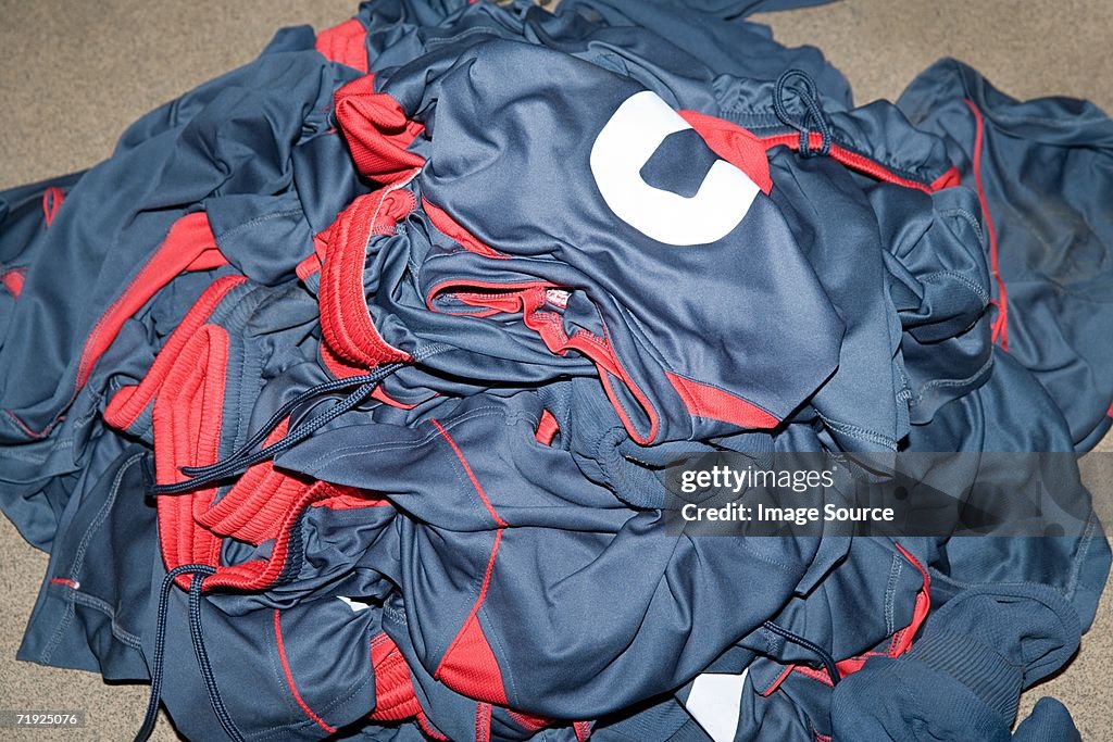 Pile of football uniforms