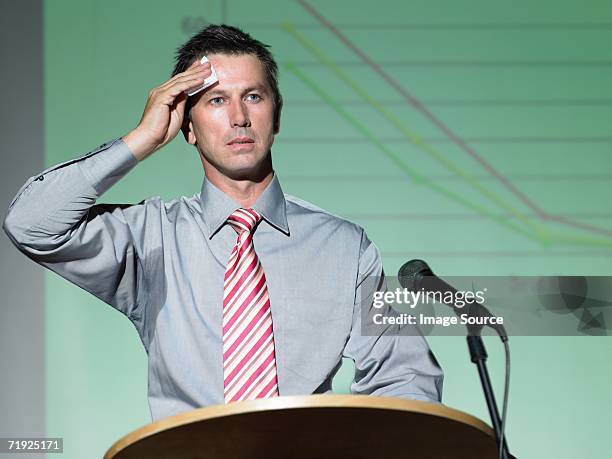 businessman giving a speech - mann erschrocken stock-fotos und bilder