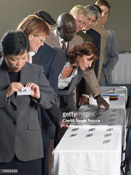 office workers with name tags - name plate stock pictures, royalty-free photos & images