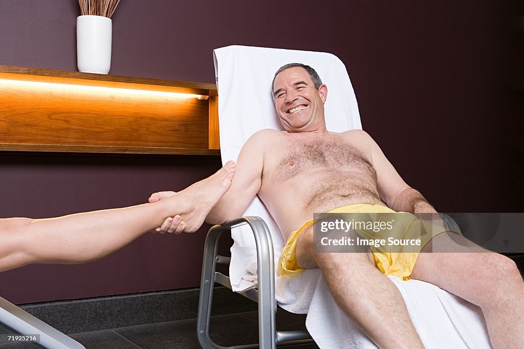 Man pulling woman's leg