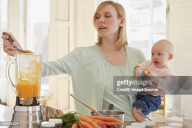 a mother cooking - babymat bildbanksfoton och bilder