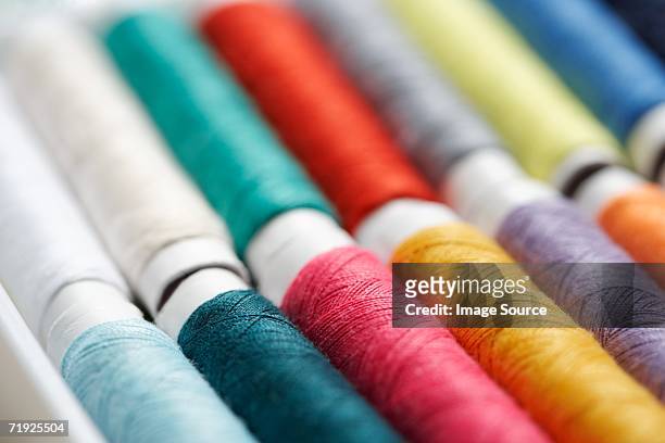 close up of cotton rolls - fabric rolls photos et images de collection