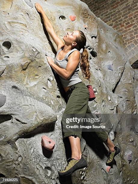 woman on climbing wall - super sensory stock-fotos und bilder