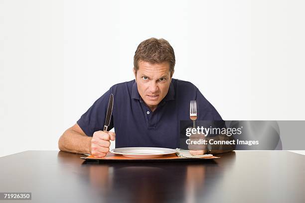 angry man waiting for meal - gaffel bildbanksfoton och bilder
