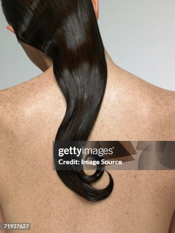 Rear view of woman with wet hair Rear view of woman with wet hair