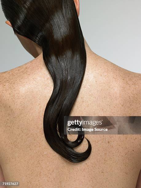 rear view of woman with wet hair - curly hair back stock pictures, royalty-free photos & images