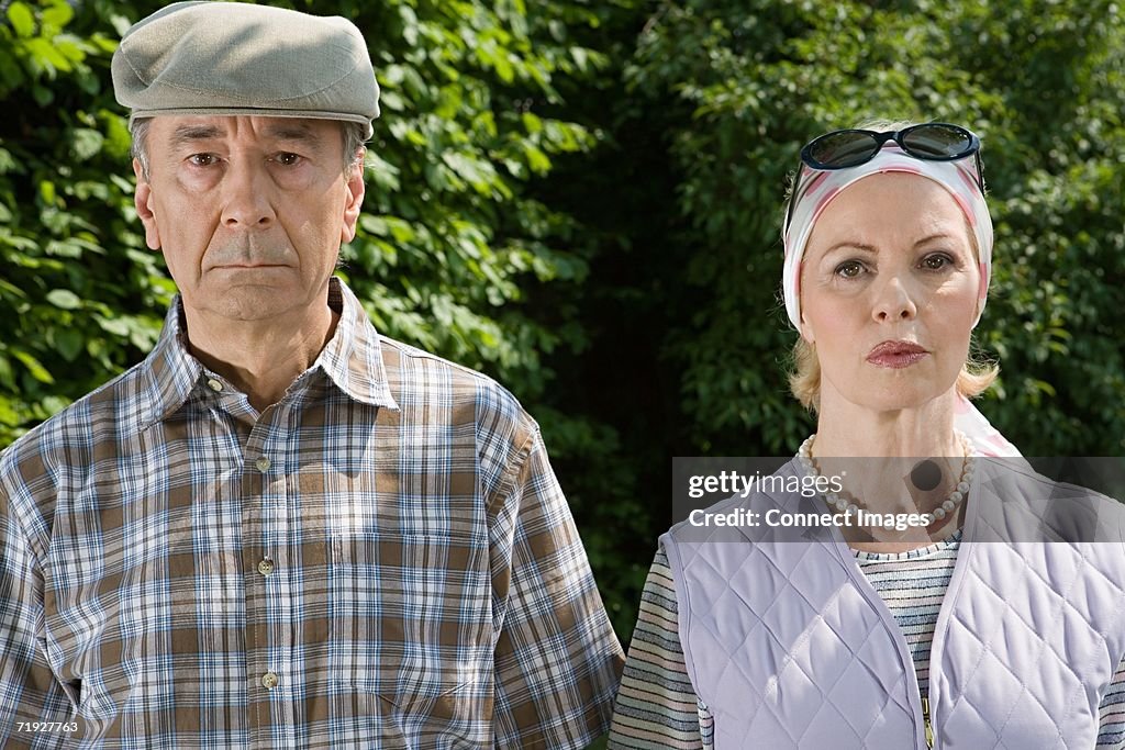 Serious senior couple