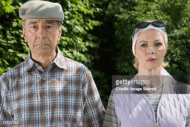 serious senior couple - grumpy man stock pictures, royalty-free photos & images