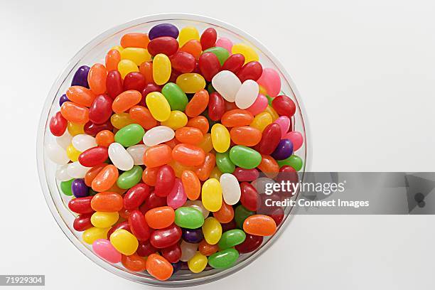 bowl of jellybeans - jellybean stock pictures, royalty-free photos & images