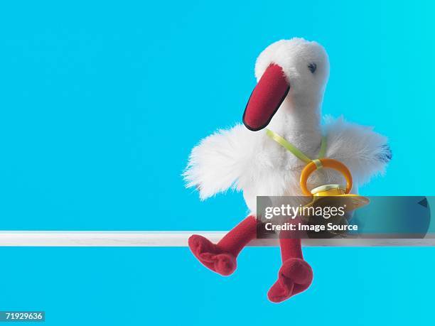 stork toy with pacifier - baptism gift stock pictures, royalty-free photos & images