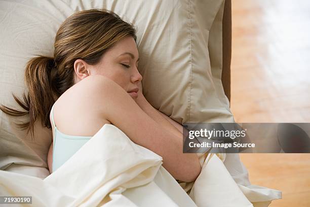 woman sleeping - pferdeschwanz stock-fotos und bilder