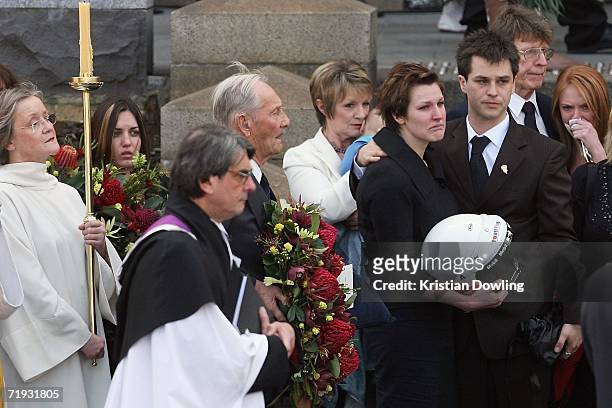 Alexandra Summers, daughter of Peter Brock is consoled by husband Elliot Summers following his state funeral at St Pauls Cathedral September 19, 2006...