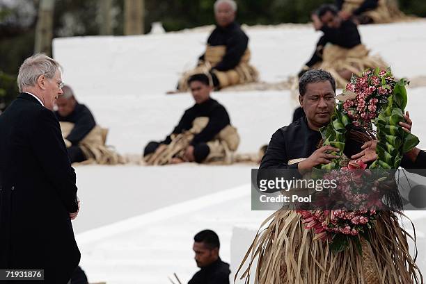 The Duke of Gloucester watches as the royal undertaker receives his wreath for the tomb of the late King Taufa'ahau Tupou IV at his state funeral on...