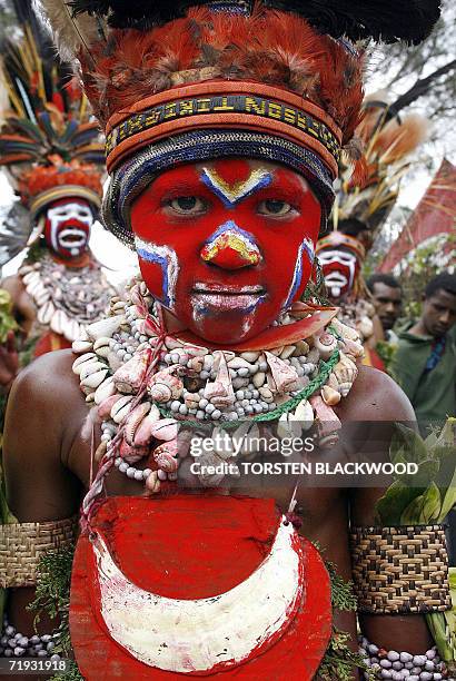 Goroka, PAPUA NEW GUINEA: A Kora child wears a kina shell breastplate during the 50th Goroka singsing in what is believed to be the largest gathering...