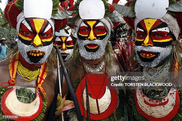 Goroka, PAPUA NEW GUINEA: Nebilyer warriors march towards the 50th Goroka singsing in what is believed to be the largest gathering of indigenous...