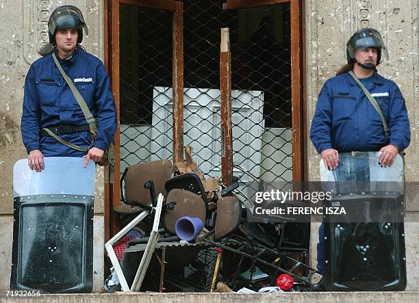 Hungarian riot policemen stand at the main gate of the Hungarian national television 19 September 2006 after the building was occupied late 18...
